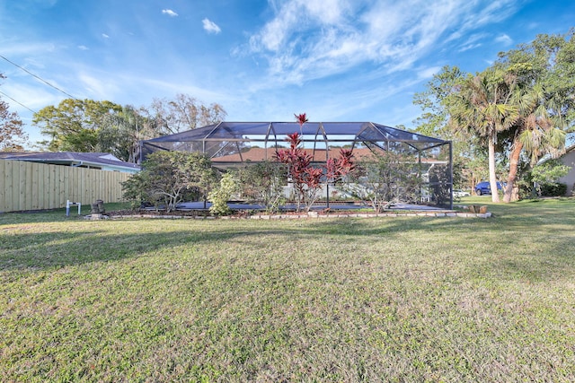 view of yard featuring glass enclosure