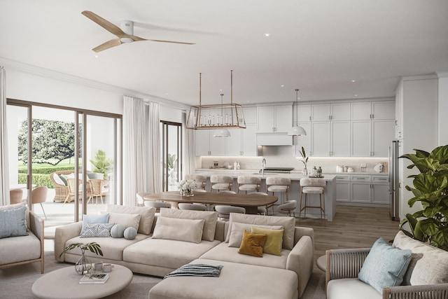 living room with hardwood / wood-style flooring, ceiling fan, and sink