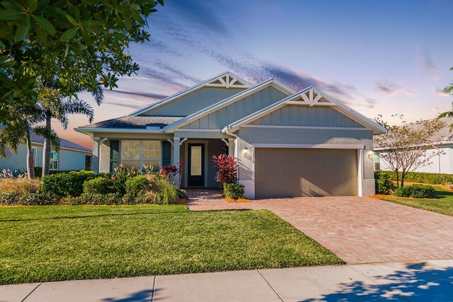 view of front facade with a front lawn and a garage