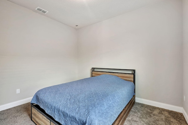 bedroom featuring a textured ceiling