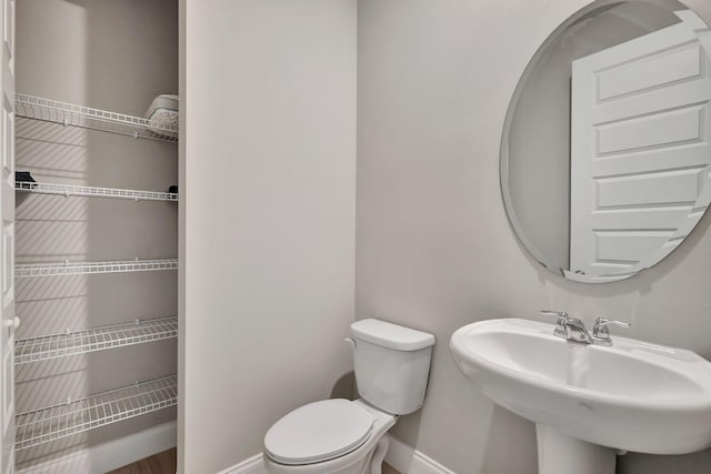 bathroom with toilet and sink