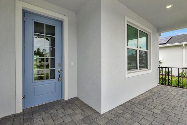 doorway to property featuring covered porch