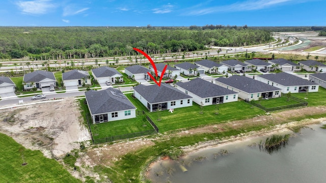 birds eye view of property featuring a water view