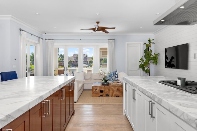 kitchen with ceiling fan, range hood, light hardwood / wood-style floors, white cabinetry, and stainless steel gas cooktop