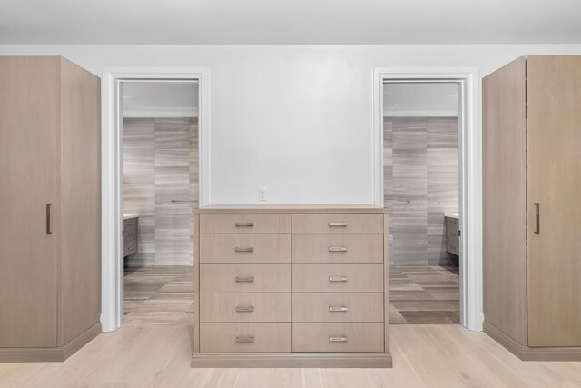 bedroom featuring ceiling fan, crown molding, and light wood-type flooring