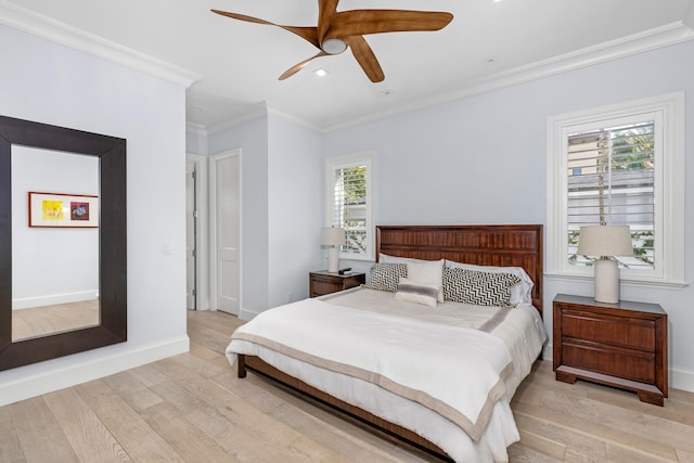 bedroom with multiple windows, ceiling fan, crown molding, and light hardwood / wood-style flooring