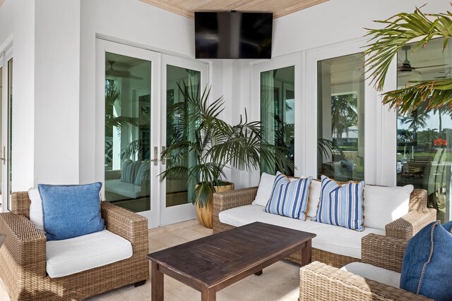 view of patio / terrace featuring ceiling fan, a boat dock, grilling area, area for grilling, and a water view