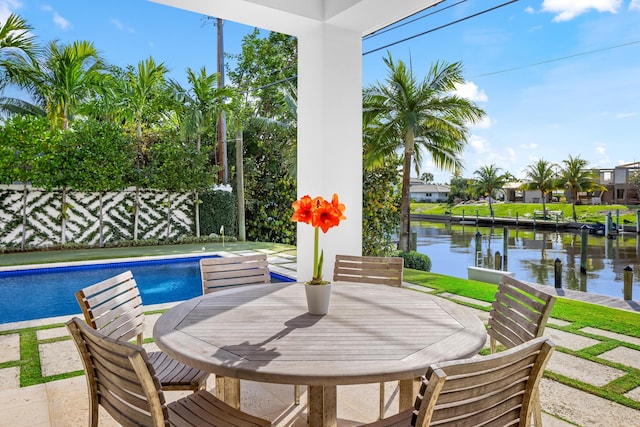 view of patio featuring a water view