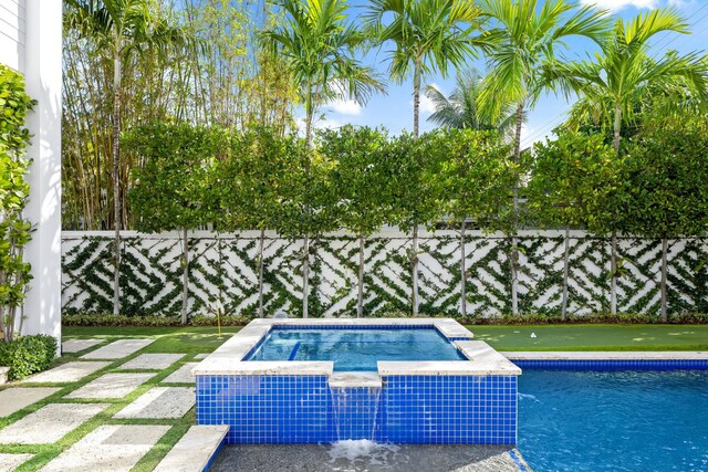 view of swimming pool with a water view