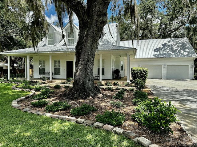 view of front of house featuring covered porch and a garage