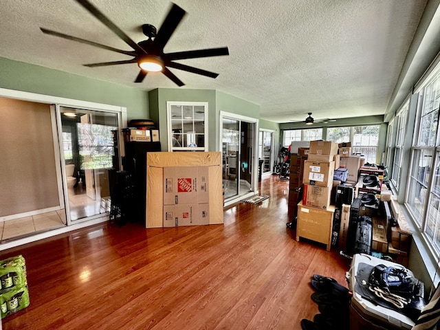 interior space featuring hardwood / wood-style floors and a textured ceiling