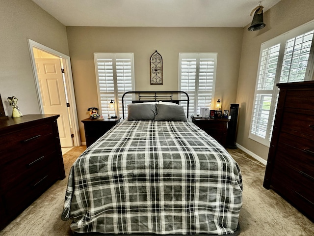 bedroom with light colored carpet