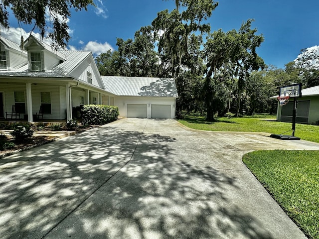 view of home's exterior with a lawn and a garage