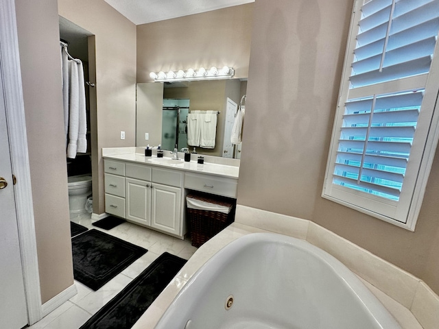 full bathroom featuring tile patterned floors, vanity, independent shower and bath, and toilet