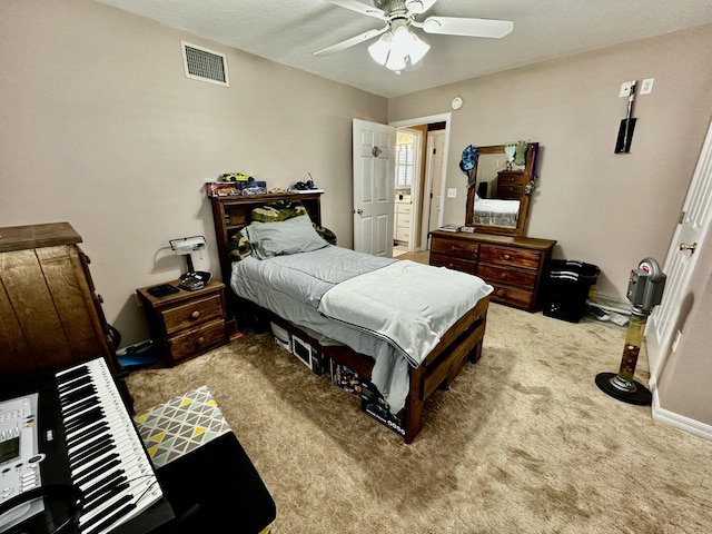 bedroom with ceiling fan and carpet