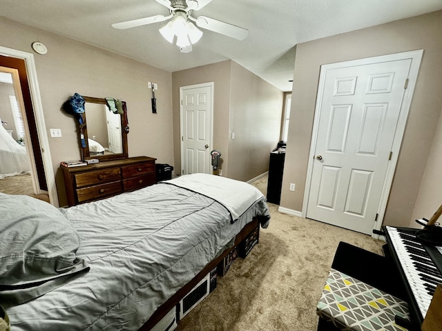 bedroom featuring ceiling fan and light carpet