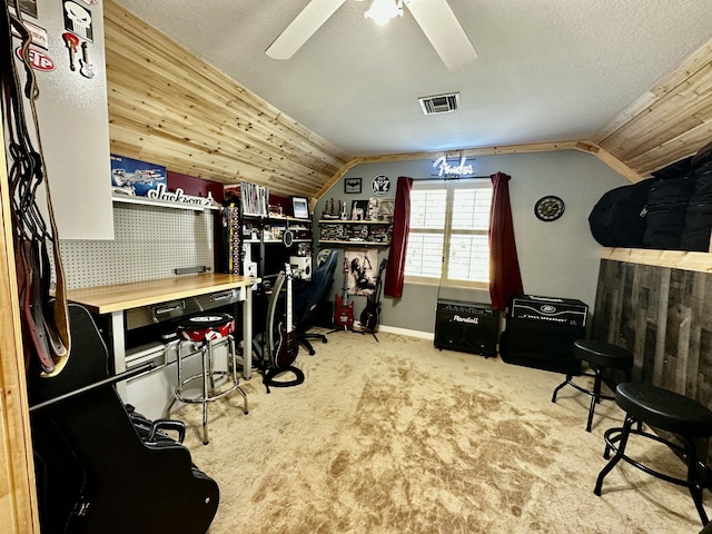 office with ceiling fan, a workshop area, a textured ceiling, lofted ceiling, and light carpet