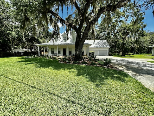 view of front of property with covered porch and a front lawn