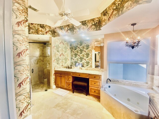 bathroom featuring separate shower and tub, vanity, and ceiling fan with notable chandelier