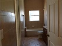 bathroom with tile patterned flooring, vanity, and toilet