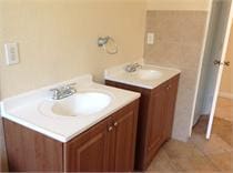 bathroom with tile patterned floors and vanity