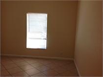 tiled empty room with a healthy amount of sunlight