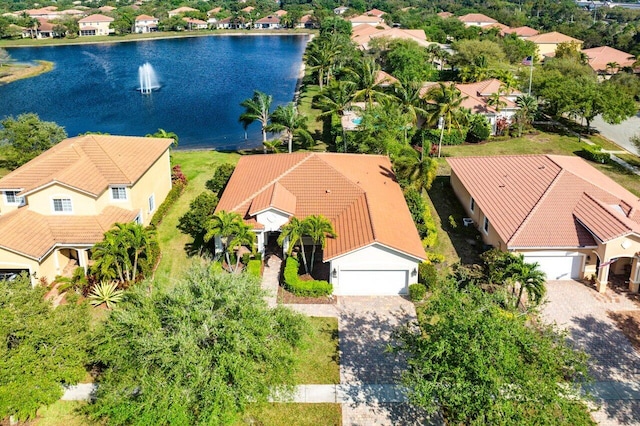 bird's eye view featuring a water view and a residential view