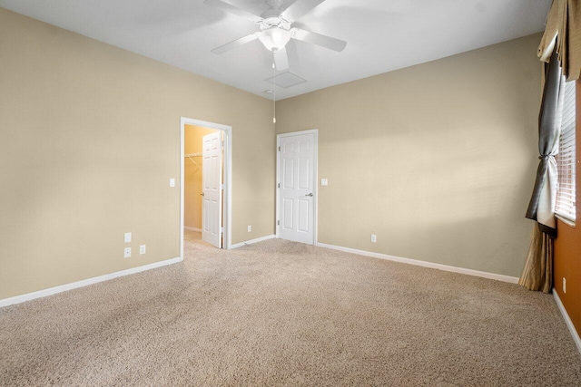 empty room with ceiling fan and light colored carpet