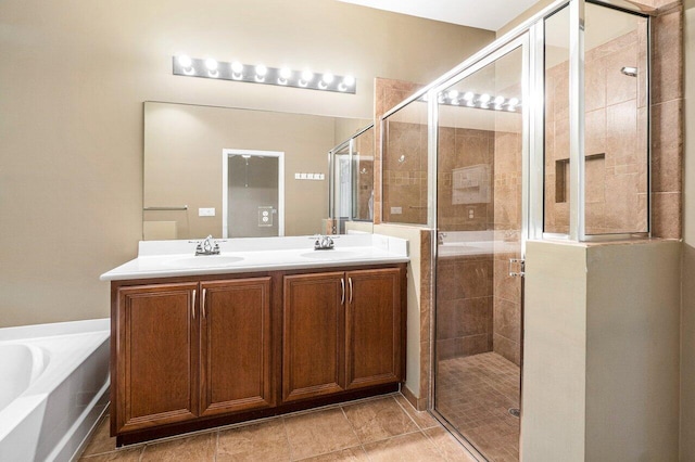 bathroom with vanity and independent shower and bath