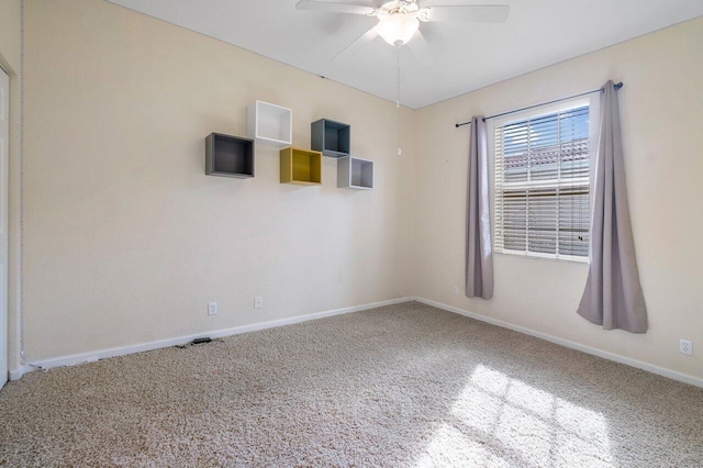 spare room with carpet flooring and ceiling fan