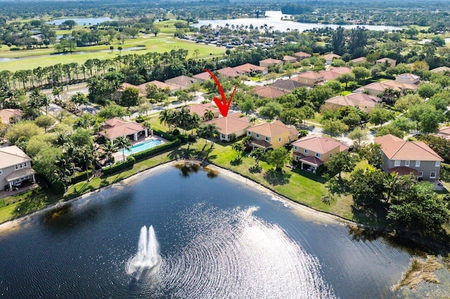 drone / aerial view featuring a residential view and a water view