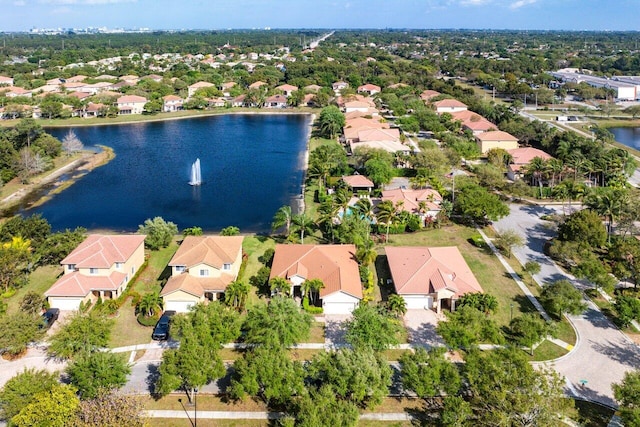 birds eye view of property with a water view and a residential view