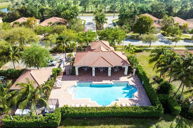 pool featuring a patio area and fence