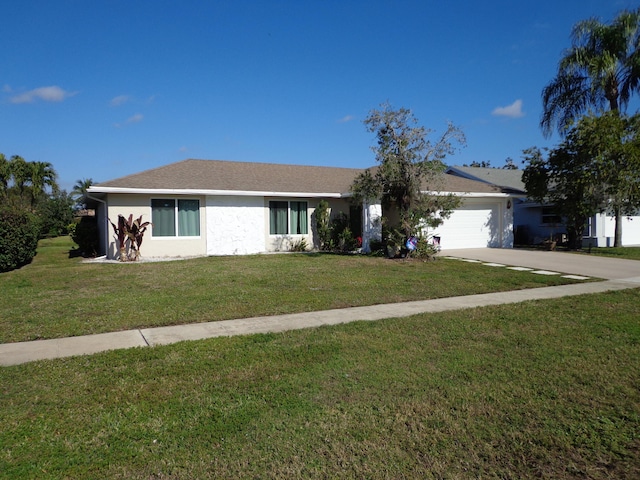 ranch-style home with a front yard and a garage