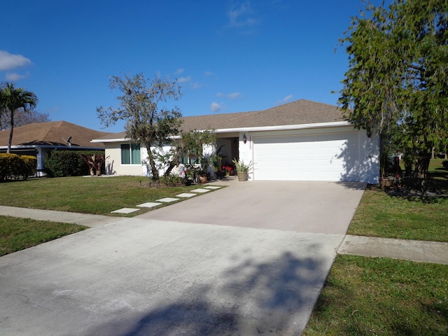 ranch-style home featuring a front yard and a garage