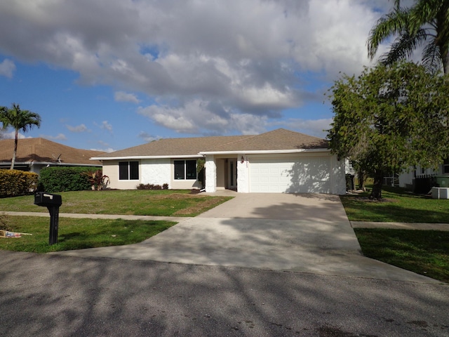 single story home with a garage and a front yard