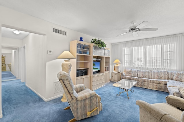 living room featuring ceiling fan and carpet floors