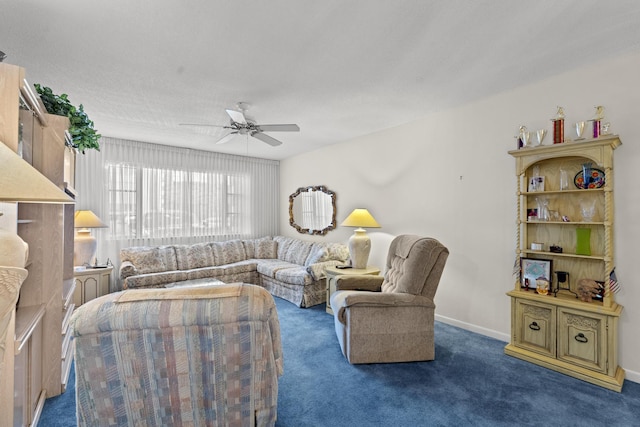 living room featuring ceiling fan and dark carpet