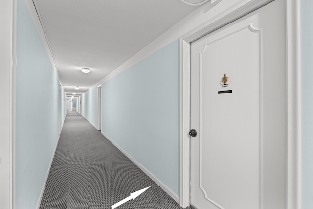 corridor with carpet flooring