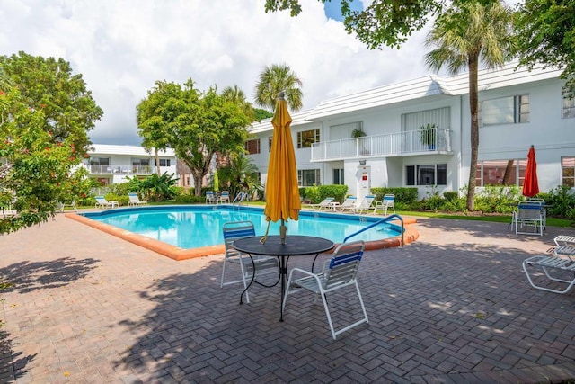 view of pool featuring a patio area