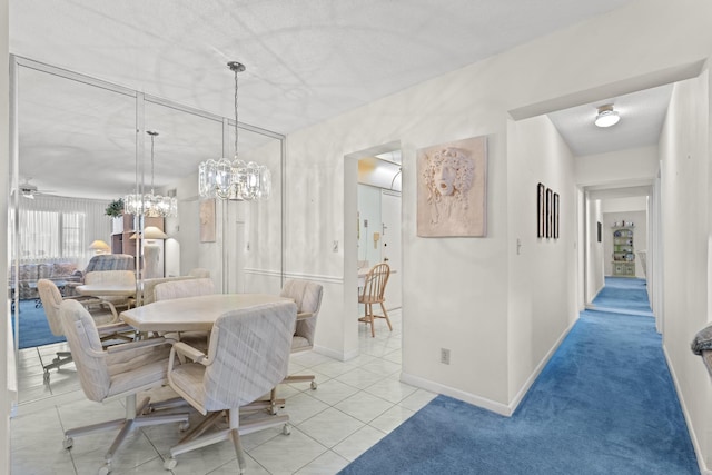 tiled dining area with ceiling fan