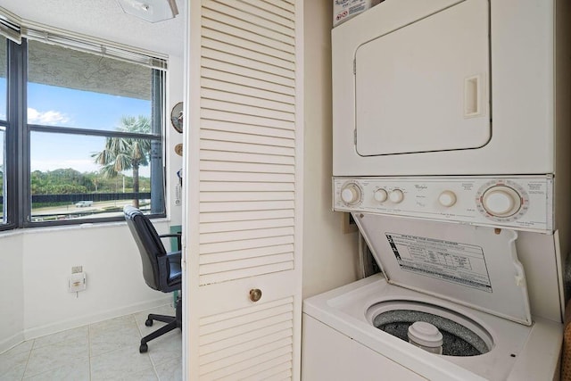 laundry area featuring stacked washer and dryer