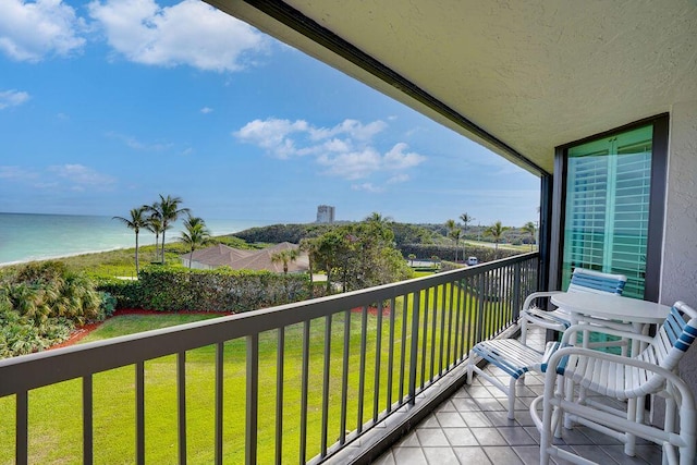 balcony featuring a water view