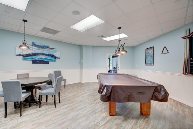 rec room with french doors, light wood-type flooring, a paneled ceiling, and billiards