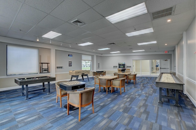 rec room featuring carpet flooring and a drop ceiling