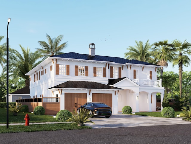 view of front of property with a garage and a balcony