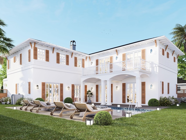 rear view of property featuring french doors, a balcony, a yard, and a patio