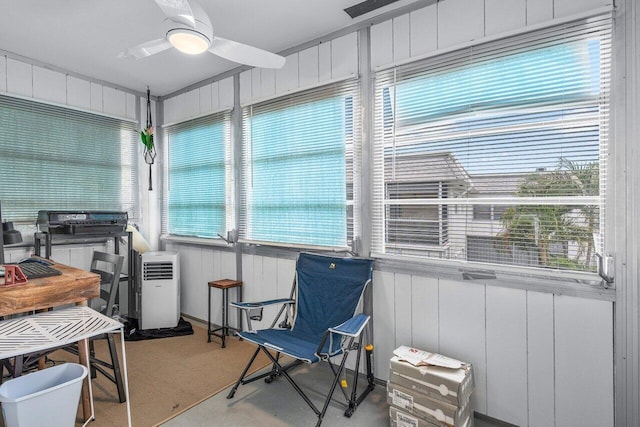 sunroom featuring a wealth of natural light and ceiling fan