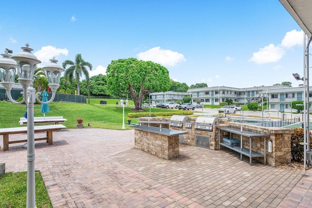 view of patio with a grill and an outdoor kitchen