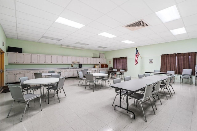 dining area with a drop ceiling